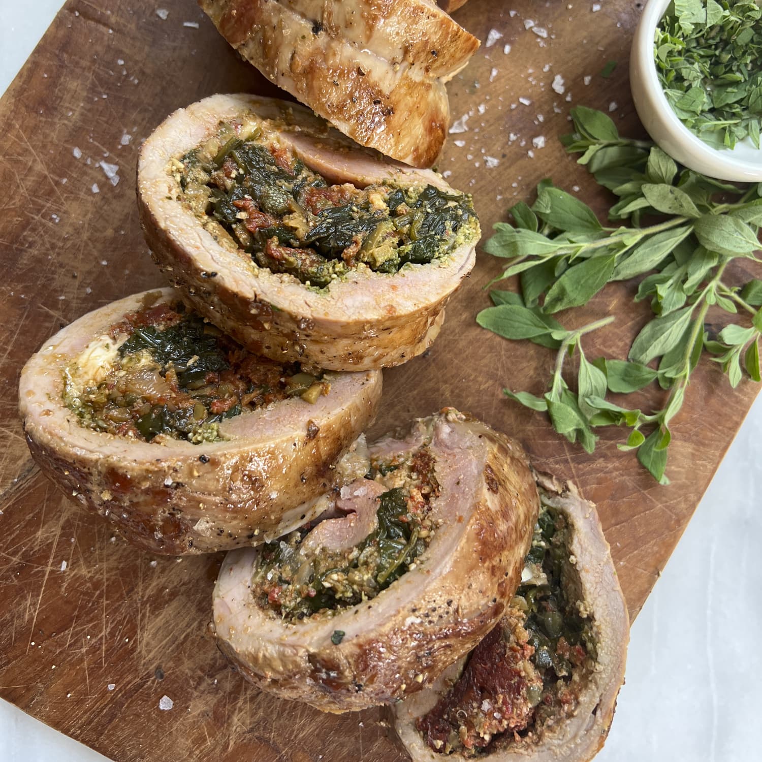 Stuffed Pork Tenderloin with Spinach Mozzarella Roasted Red Peppers and Pesto